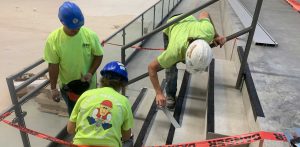 Men working on cement stairs